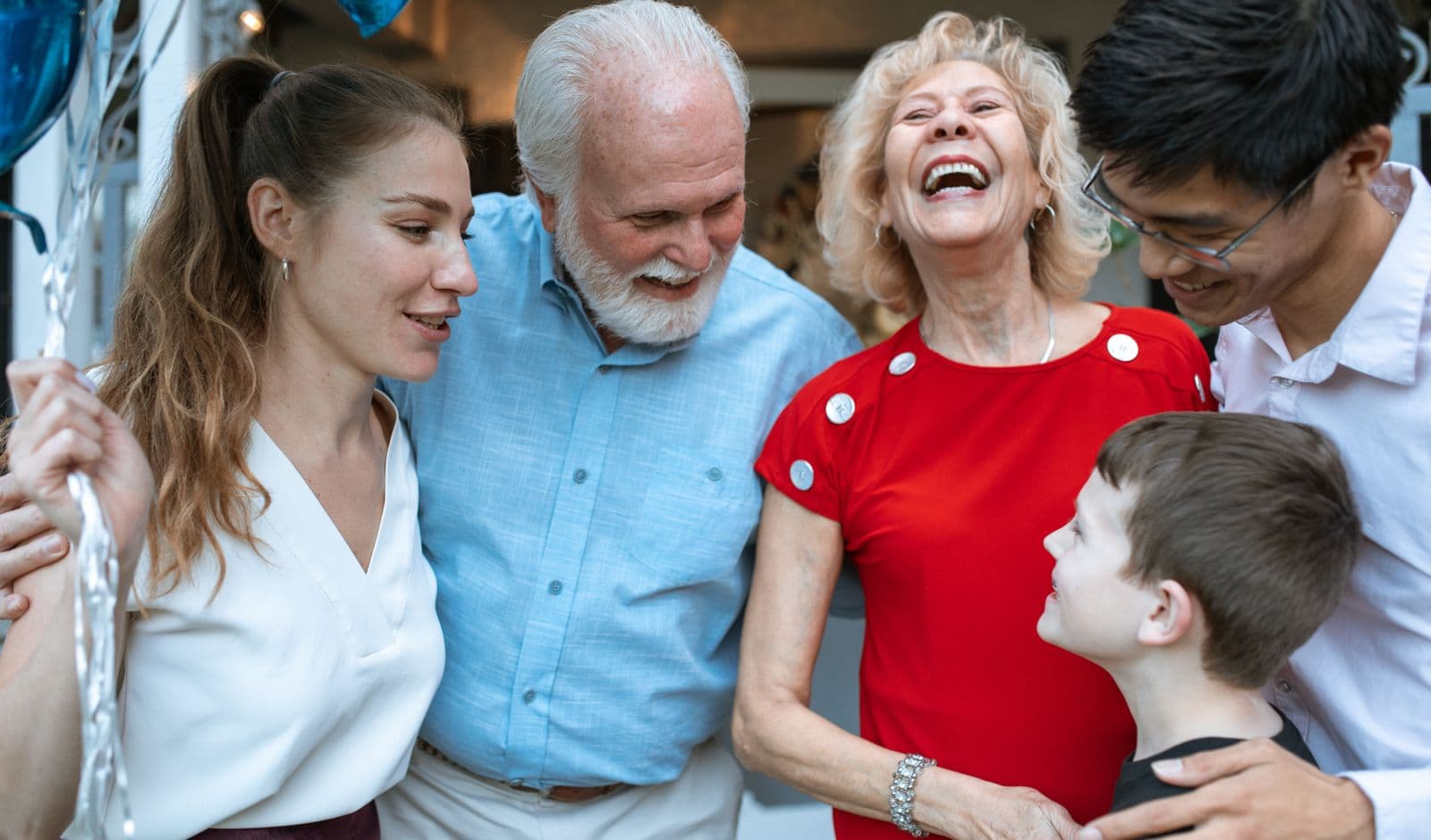 Three generations of a family laughing together